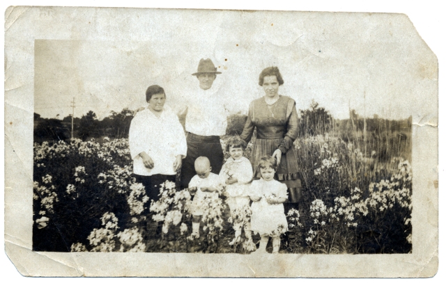 Photo taken in the summer of 1919 depicting my grandparents Katarzyna and Alex Kowal (left and center) with my father Anton (standing in front of Alex). The mother and two children are possibly Veronica Grushewsky and her children Alex and Olga. Click to enlarge.