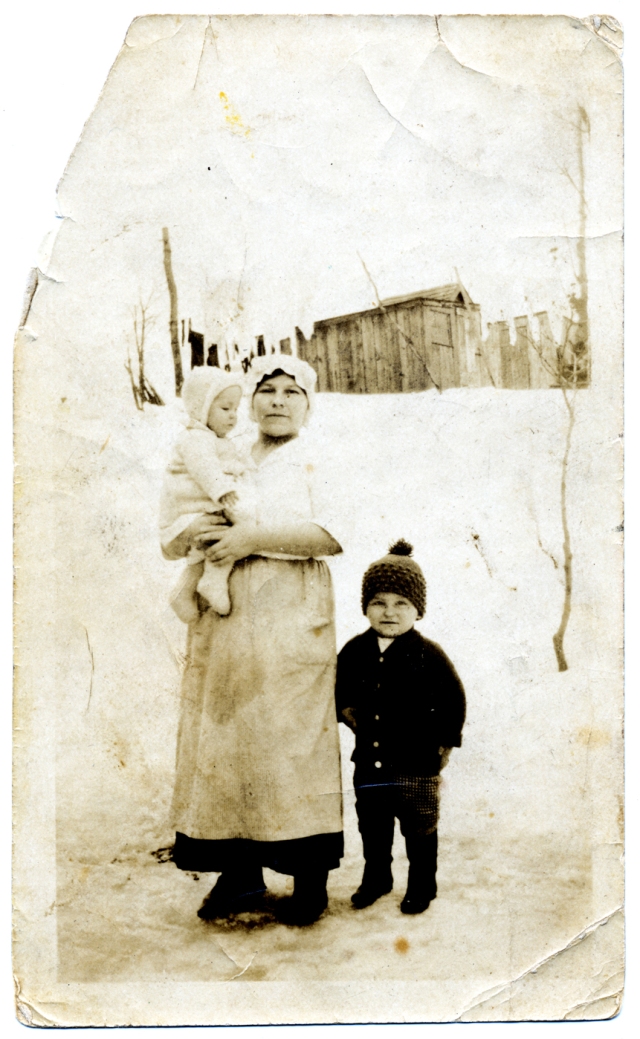 My grandmother Katarzyna Bosakowska Kowal with son Anton (standing at right) and daughter Mary. The photo was probably taken after the blizzard of February 1920 in the backyard of their home at 4658 Arthur Kill Road. Click to enlarge.