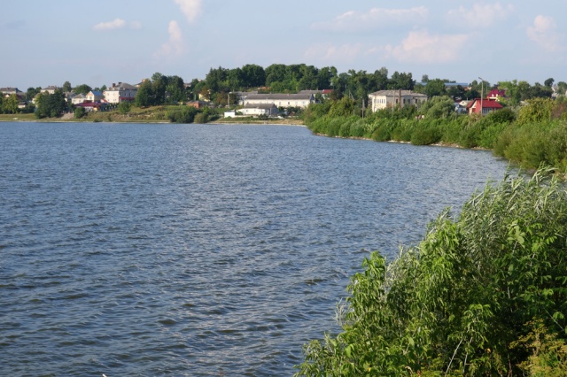 View of Zalozce from the shore of the pond. Click to enlarge.